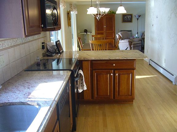 Kitchen through to family room with 2 sets of sliding doors