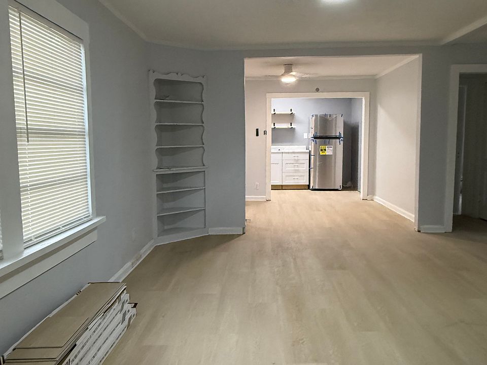 Living, Dinning and kitchen, new floors throughout the home.
