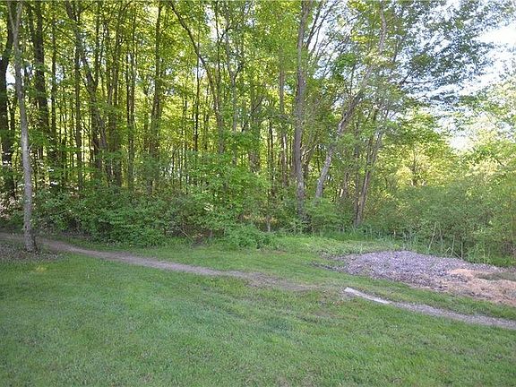 Bike path into wooded area in back of property