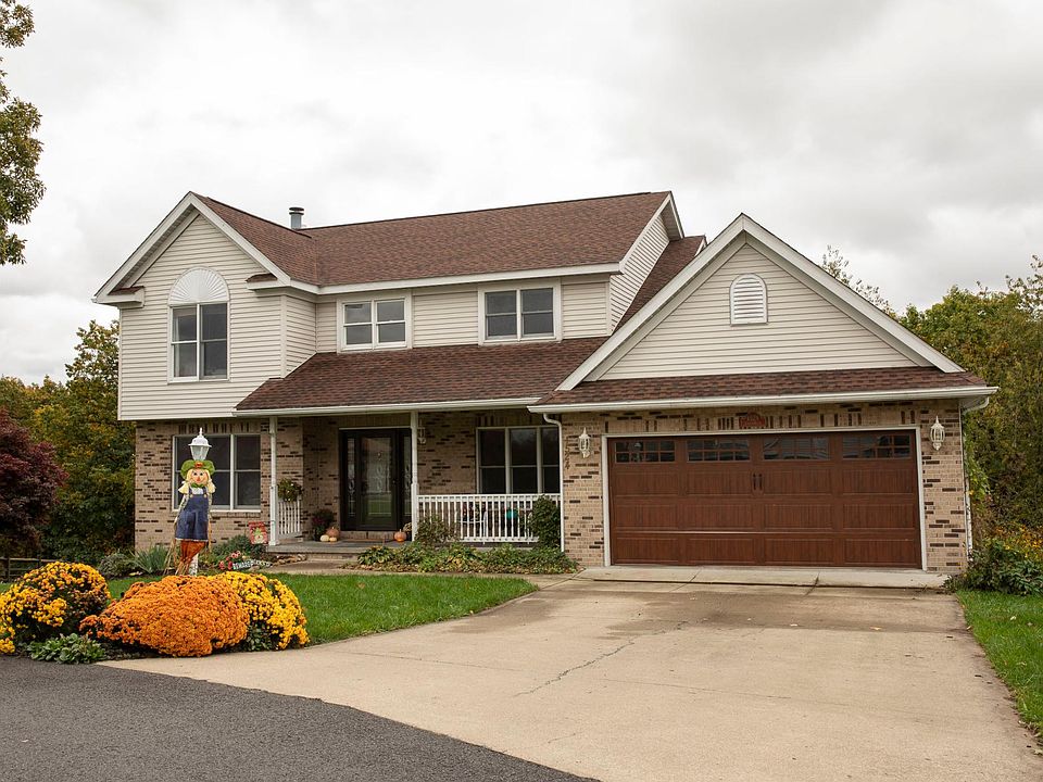 Located on a private cul-de-sac with only woods behind the home.