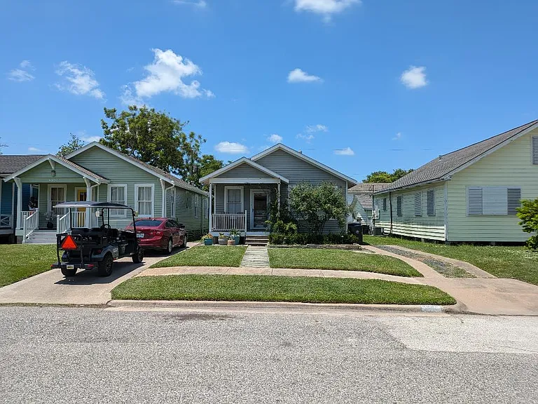 4906 Ave R Front with driveway parking for 2 cars to right