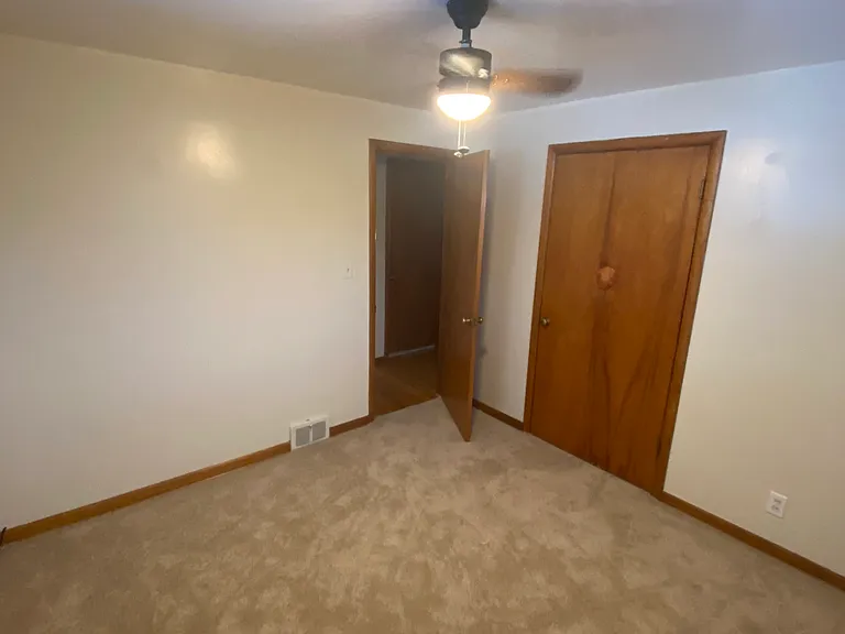 2nd Bedroom Showing Closet and Exit Door
