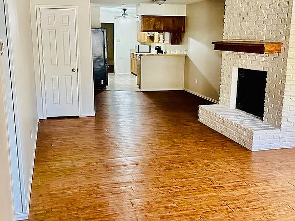 Living room w/view of kitchen and dining area