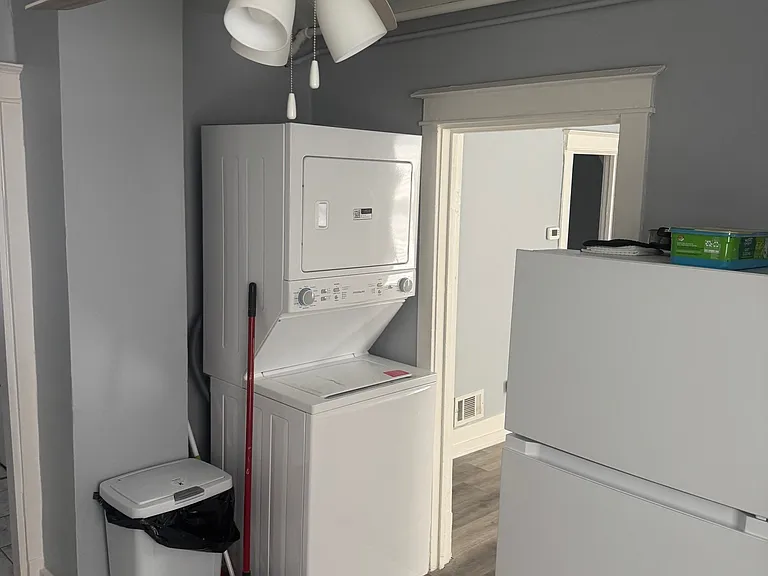 Unit B kitchen includes brand new washer and dryer.