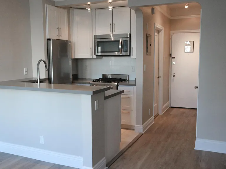 Nob Hill Place ~ Newly renovated residences with track lighting, designer wood flooring, breakfast bar, quartz counters, stainless steel appliances, gas stove, microwave