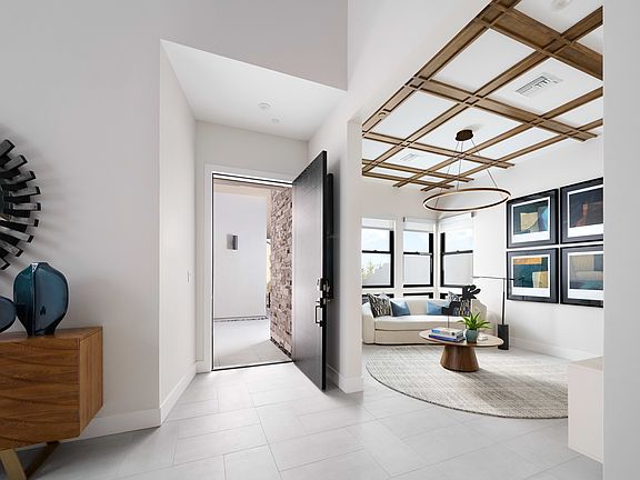 A modern and stylish interior design featuring a wooden ceiling with exposed beams, a cozy living ro