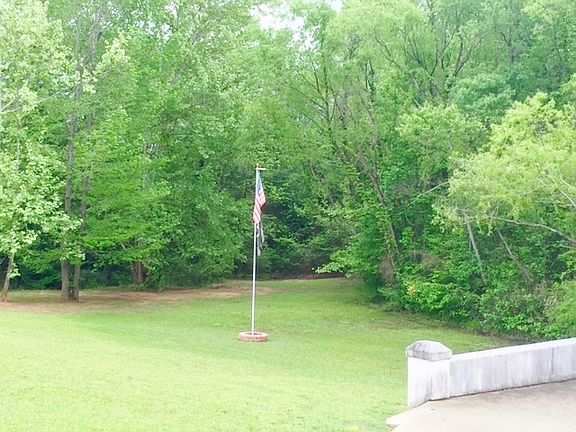 Creekside with flagpole