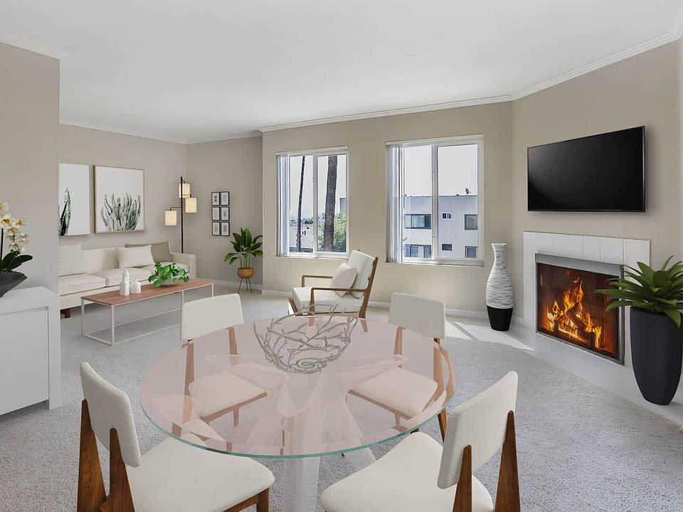 Carpeted Living Room with Fireplace