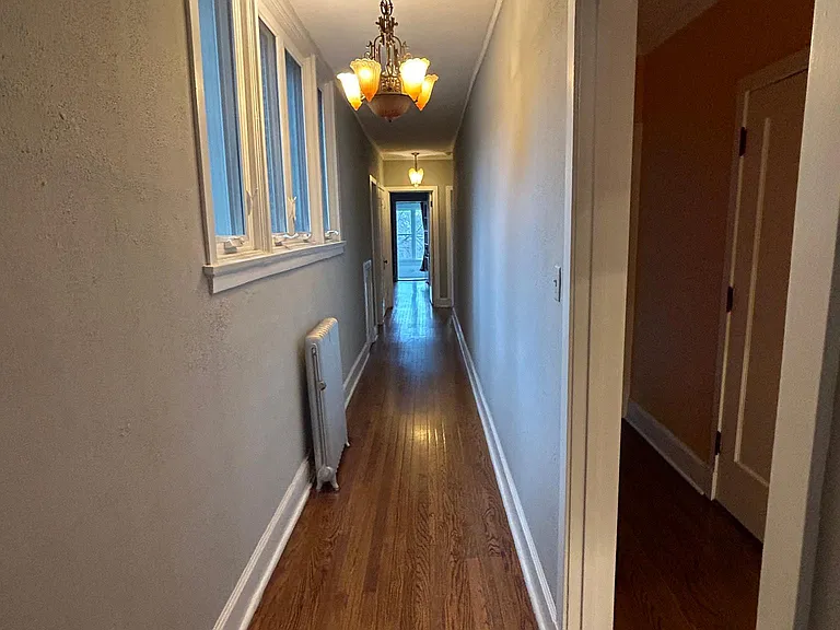hallway to 2 of the bedrooms and north porch