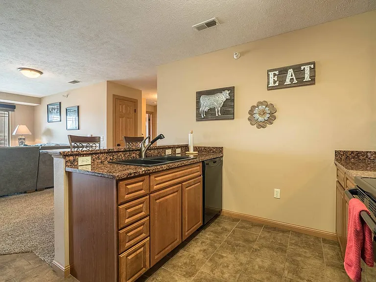 Enjoy an open-concept kitchen and dining area, perfect for casual meals or entertaining guests.
