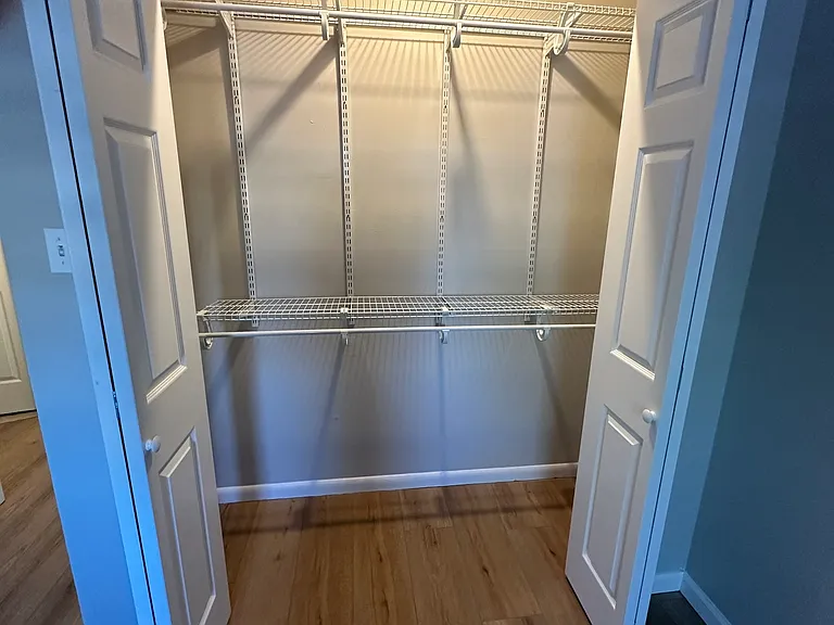 Second bedroom closet featuring extra shelving and added storage.