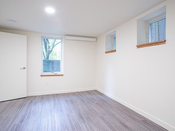 Bedroom with west and north facing windows.