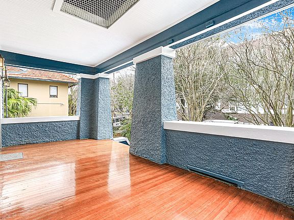 Gorgeous refinished wood on oversized porch