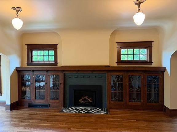 Gas fireplace with custom tile hearth.