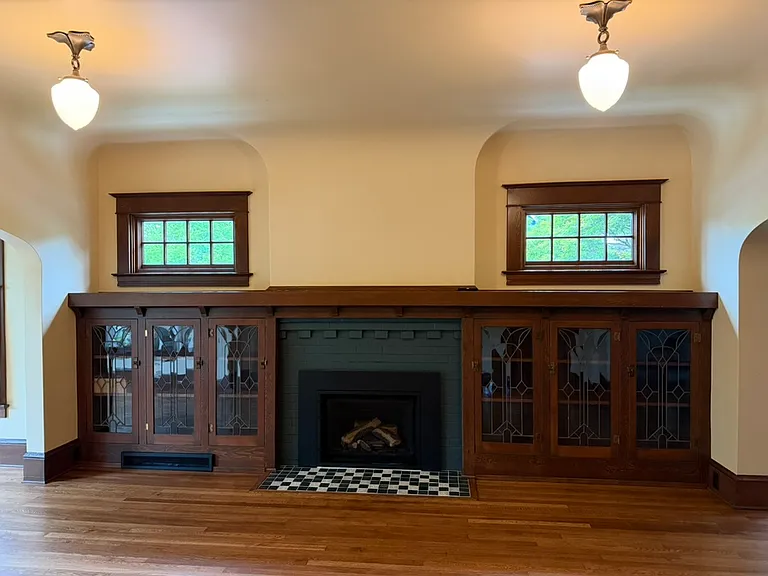 Gas fireplace with custom tile hearth.