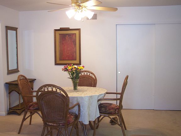 Dining Area with Lighted Ceiling Fan