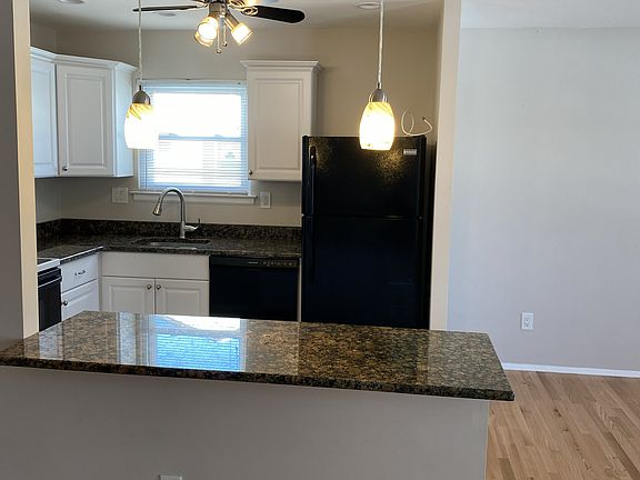 Kitchen View with Penninsula with Pendant Lighting
