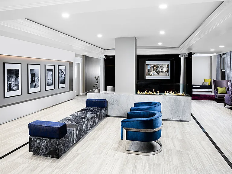 Peaceful resident lounge featuring plush seating, fireplaces, and thoughtful millwork