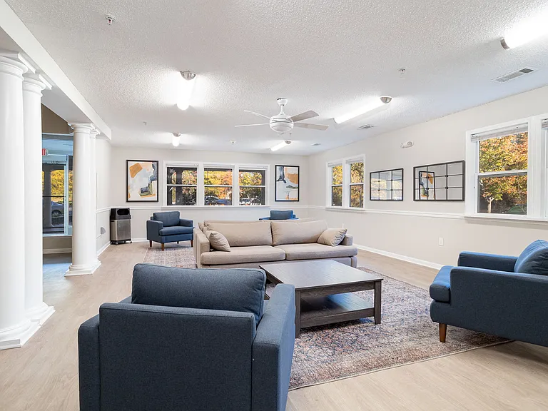 Unwind in our comfortable lounge with couches, chairs, and coffee table for relaxing with friends, professionally operated by Highlands Vista Group