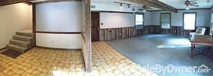 Living room and dining area
						:
						Walk-in storage closet under the stairs
Sliding glass door opens to patio area