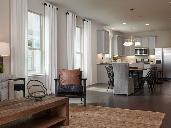 Model Representation - Open floorplan showcasing kitchen, spacious gathering room and dining areas