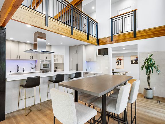 Dining Room open to Living Room above adjacent to Game Room / Theater.