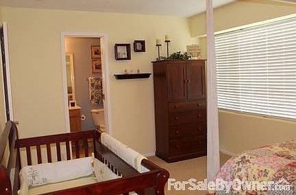 2nd bedroom leading into 2nd bathroom