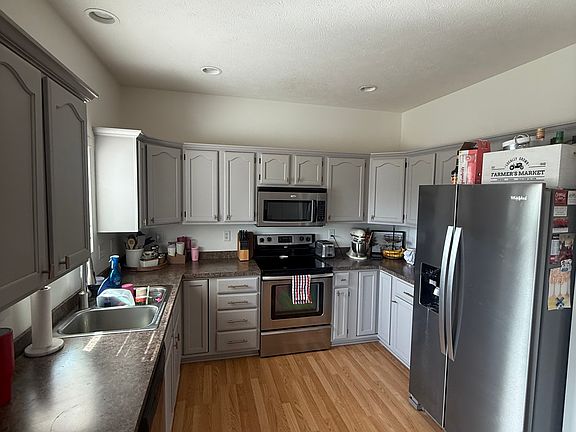 Kitchen w/lots of storage and new fridge.