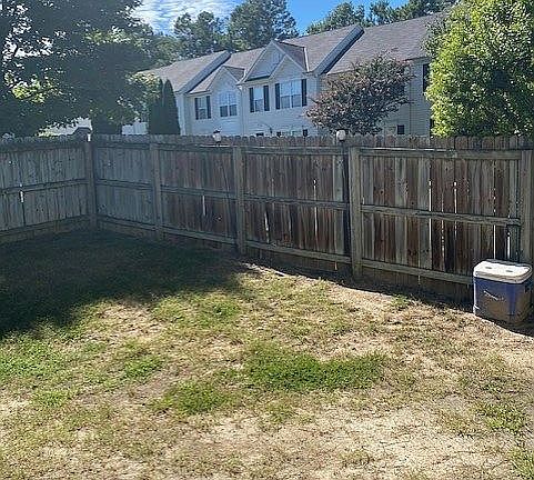Fenced corner yard with gate