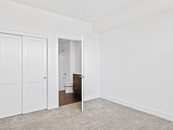 Light & Airy Secondary Bedroom Suite on 1st Floor w/ Oversized Windows. Would also make great home office!
