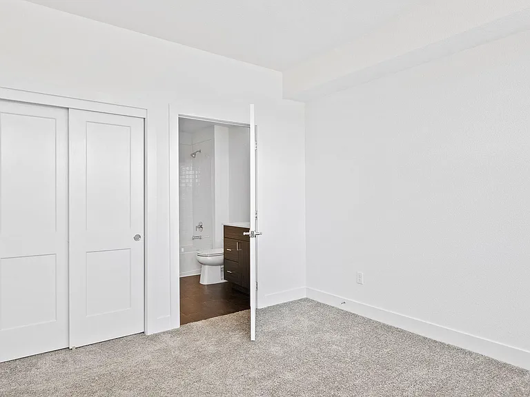 Light & Airy Secondary Bedroom Suite on 1st Floor w/ Oversized Windows. Would also make great home office!