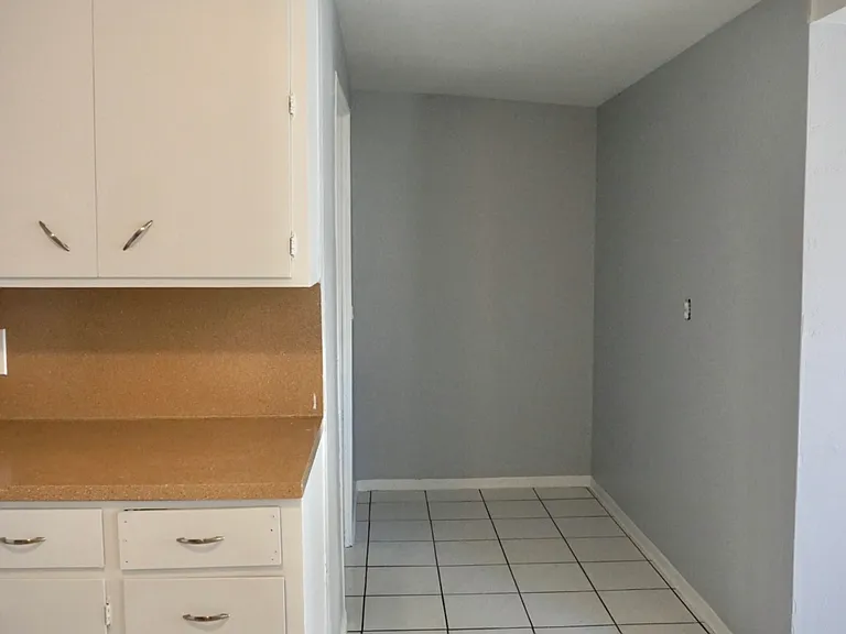 Entryway from carport door towards kitchen / secondary living room