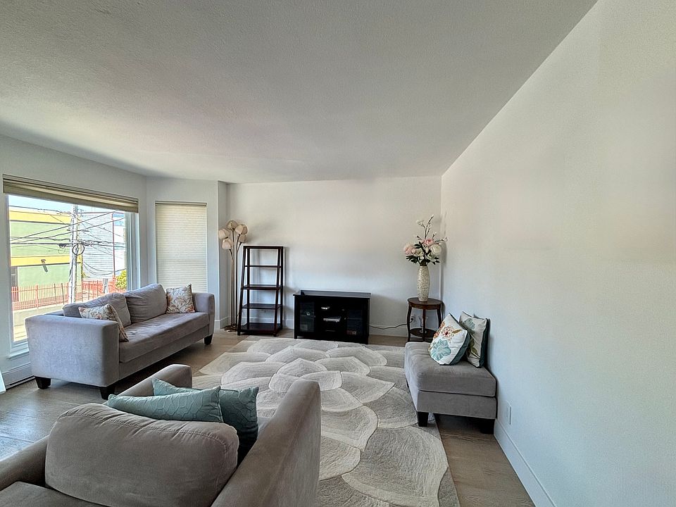 Living room, with street facing windows