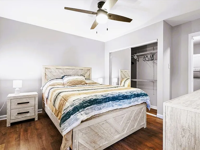 Upstairs bedroom with a queen bed, blackout curtains, and full en-suite bathroom.