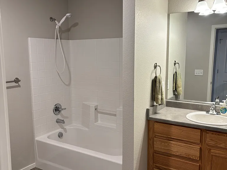 Vanity has ample drawer and cabinet space.