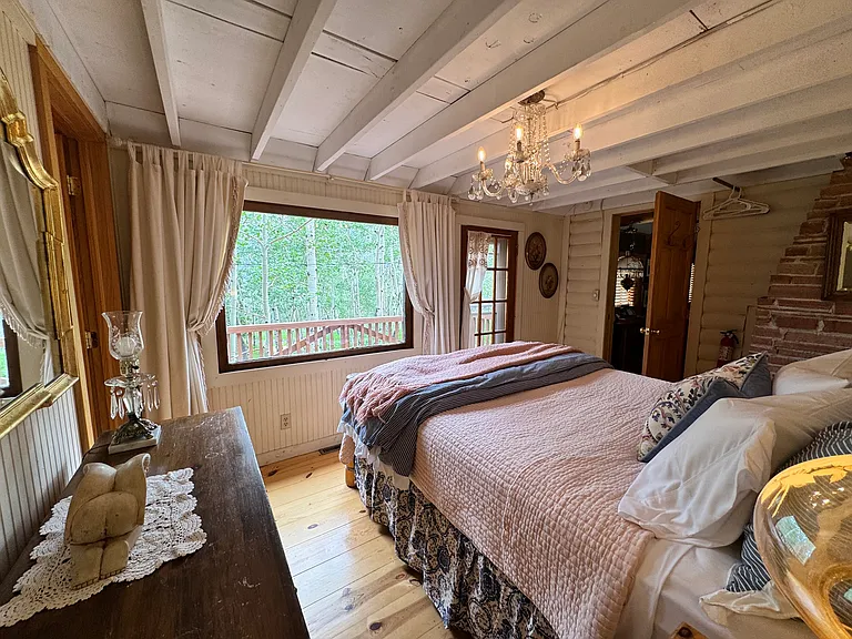 Master bedroom with door to private deck