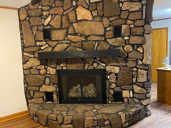 Natural stone gas log fireplace