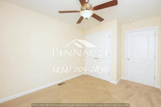 First Bedroom Upstairs with Closet Space and Ceiling Fans