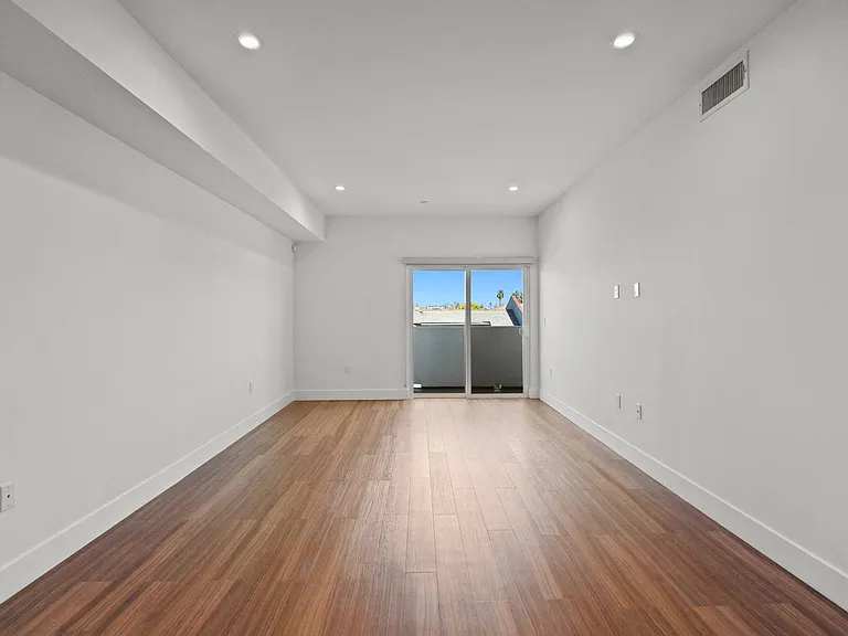 Open-Concept Dining and Living Room Space with Patio