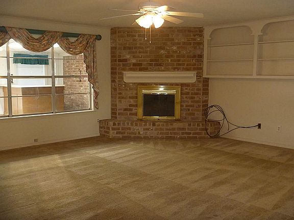 Corner gas log fireplace.