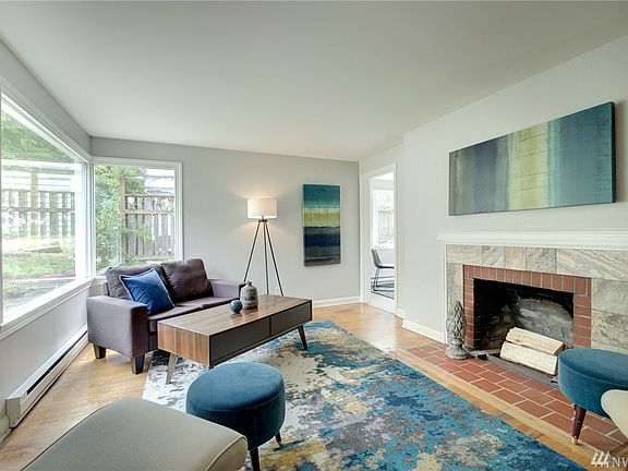 Hardwood floors, fireplace, big windows...great bones in this house!