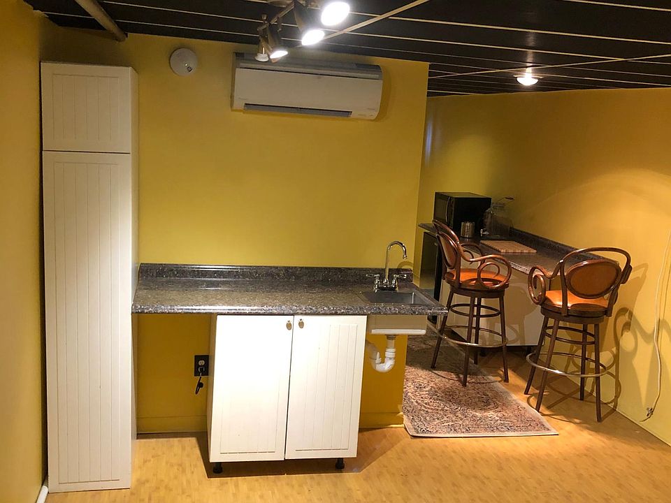 Kitchen sink/pantry located in LR/DR area. Cooking area and compact frig. Located in adjacent hallway.