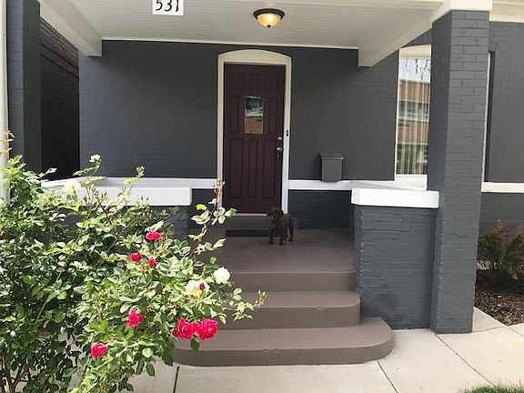 Covered front porch, chain link fence keeps our four legged family members safe!