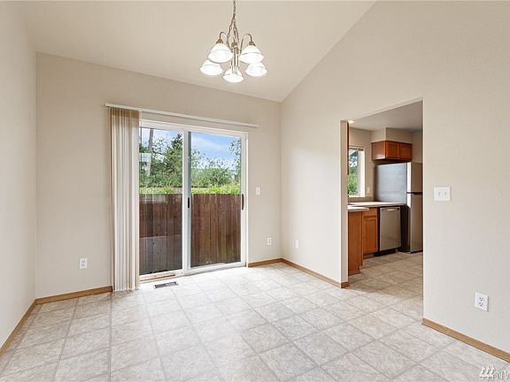 The gracious dining, conveniently located just off the kitchen, is generously proportioned. 