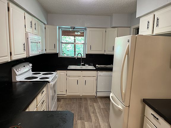 Kitchen; electric stove and garbage disposal