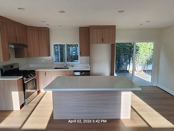KITCHEN WITH SLIDING DOOR TO BACKYARD