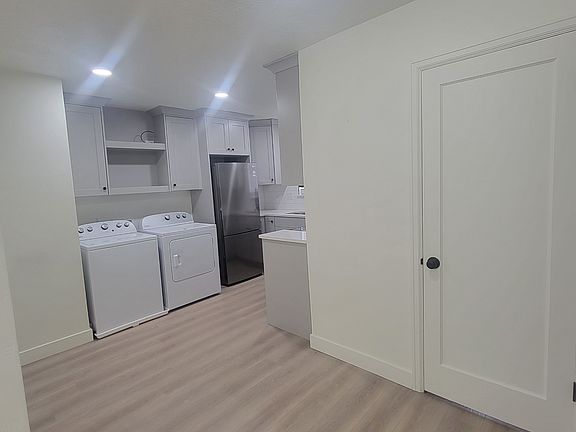this shows the small dining area and the laundry area just out side of the kitchen