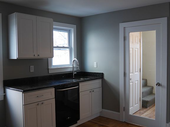 Undermount stainless steel sink with modern pull-down faucet