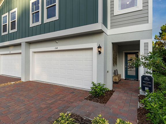 Mustang covered entry at Blue Springs Reserve by Trinity Family Builders