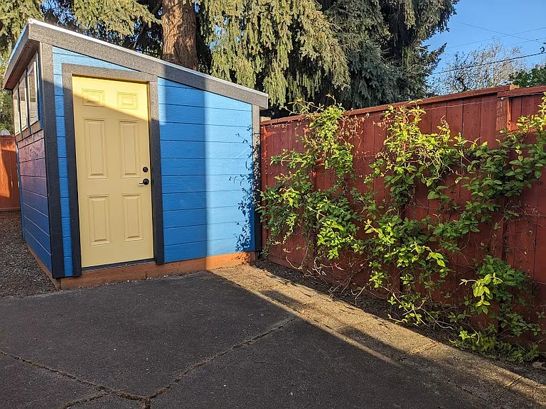 Owner shed and honeysuckle on patio